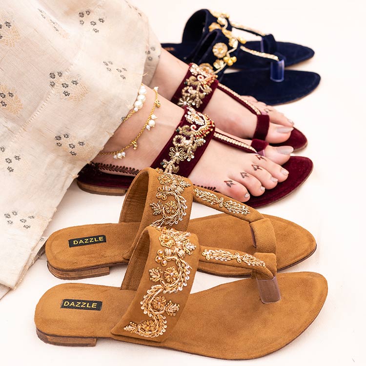Women wearing embroidered khussa and Kolhapuri sandals, traditional Pakistani footwear
